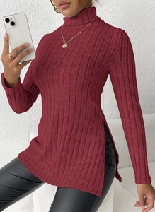 Close-up of burgundy ribbed knit turtleneck sweater featuring stylish side slit detail