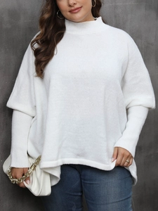Detail of white turtleneck sweater with unique layered cuffs and soft knit texture