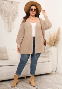 Detail view of chunky knit khaki cardigan with lantern sleeves and open front design
