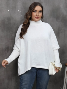 Detail of white oversized knit sweater with high neck and ribbed cuffs on batwing sleeves