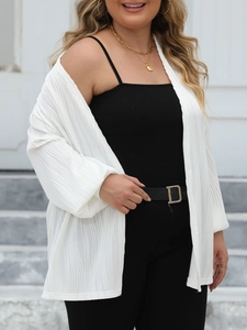 Detail of white pleated cardigan with lantern sleeves and vertical textured fabric design