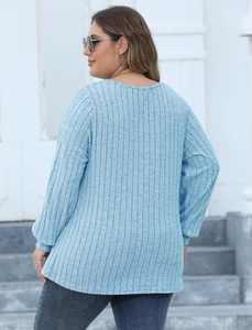 Detailed back view showing ribbed knit texture of light blue casual long sleeve top