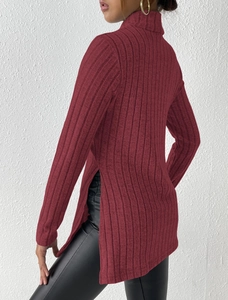 Detail of burgundy ribbed turtleneck sweater featuring a stylish side slit and slim fit