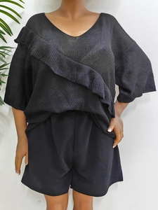 Women's black two-piece set featuring hollow out ruffle knit top and casual loose shorts