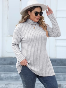 Detail of light grey rib-knit high neck long sleeve top with stylish side slit