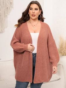 Detail of chunky knit texture on brick red open-front cardigan for women