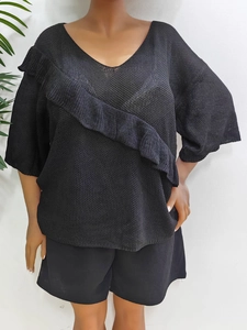 Women's black V-neck knitted top with ruffle details and breathable mesh texture