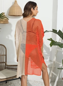 Detail of color-block crochet beach cover-up with hollow knit and side slits