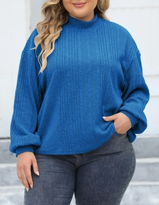 Detail of royal blue ribbed knit texture and turtle neck design on women's plus size top