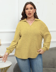 Close-up of bright yellow ribbed knit texture and V-neck collar on women's polo top