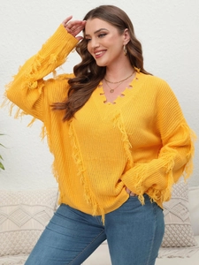 Detail of V-neck knitted sweater with fringe tassels and distressed torn edges