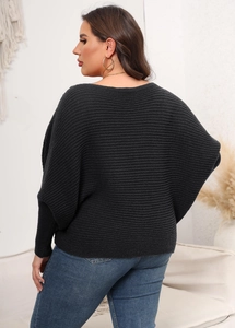 Detail of grey batwing sleeve sweater showing ribbed knit texture and back-view fit