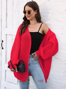 Women's chunky knit red cardigan with loose fit design and textured pattern for autumn