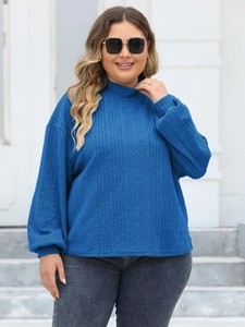 Women's blue mock neck long sleeve top with ribbed texture in a relaxed casual fit