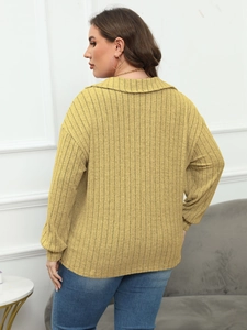 Rear view of a ginger yellow polo neck ribbed knit top with casual drop shoulders