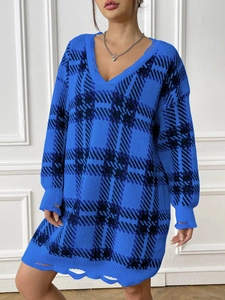 Detail of blue and black plaid knit sweater dress with V-neck and distressed ripped hem