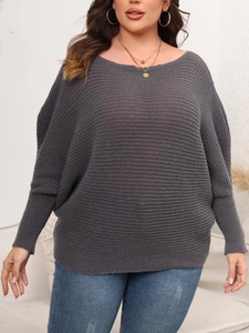 Close-up of women's dark grey off-shoulder batwing sleeve sweater with knit texture