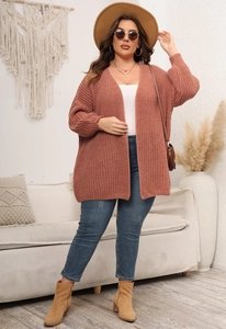 Detail of chunky knit open cardigan in terracotta featuring long drop shoulder sleeves