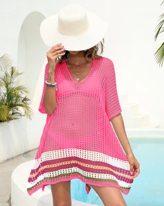Close-up of crochet hollow knit beach cover-up with colorful striped hem and V-neck