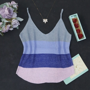 Detailed macro view of the V-neck knitted camisole with colorful horizontal stripes