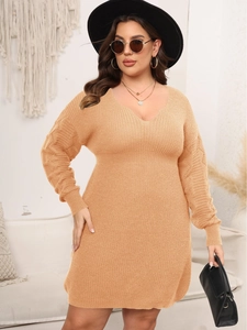 Women's plus size knit dress with deep V-neck and long sleeves in beige color