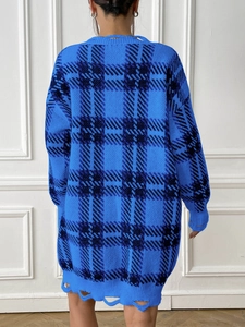 Back view of thick blue and black plaid knit sweater dress with distressed ripped hemline