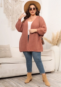 Chunky knit texture detail on a vintage pink plus-size cardigan with long sleeves
