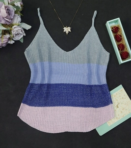 Close-up detail of knitted rainbow v-neck camisole with colorful striped patchwork texture