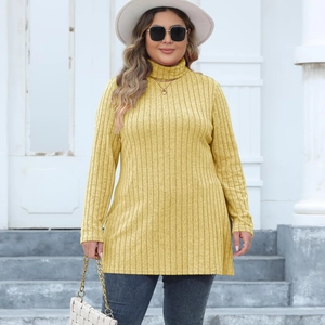 Detailed texture of mustard yellow ribbed knit tunic with side split and turtleneck
