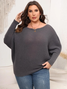 Detail of loose dark grey knit sweater with stylish batwing sleeves and round neck