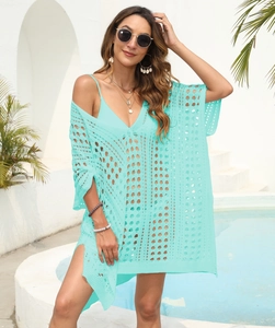 Detail of mint green crochet beach cover-up with geometric hollow out and V-neckline