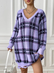 Detail of lavender oversized V-neck knit sweater with black plaid and distressed edges