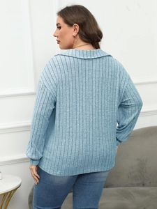 Detailed back view of light blue ribbed knit polo shirt featuring long sleeves and turn-down collar