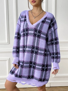 Detailed close-up of distressed knit V-neck sweater dress with purple plaid pattern