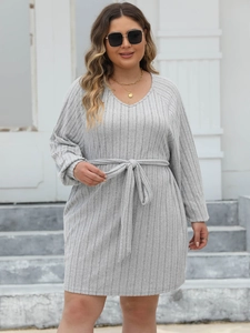 Detail of grey ribbed V-neck dress featuring a waist tie and high elasticity fabric