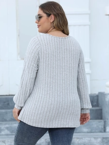 Detail showing the light grey ribbed texture and back cut of this plus size long sleeve top