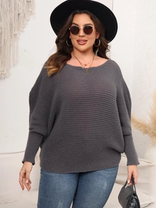 Detail of grey batwing sleeve sweater showing off-shoulder neckline and knit texture
