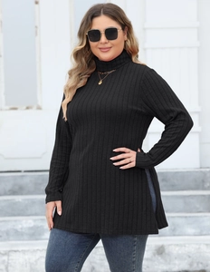 Detail shot of black ribbed knit tunic featuring high neck and stylish side slit details
