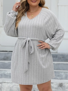 Detail of grey ribbed knit long sleeve dress showing V-neck and drawstring waist tie