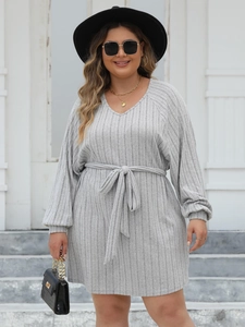 Detail of grey rib-knit V-neck dress with long lantern sleeves and matching waist tie