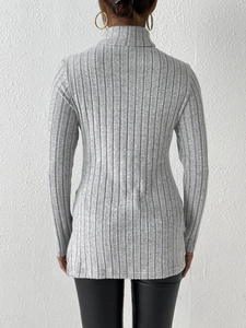 Rear view of slim fit light gray turtleneck sweater with ribbed texture and side slit