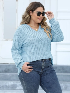 Women's light blue V-neck ribbed knit sweater with crossover detail and long sleeves