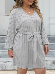 Detail of the gray ribbed knit texture and waist tie on this V-neck long sleeve dress