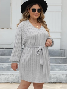 Detailed view of grey ribbed knit long sleeve V-neck dress with a waist tie belt