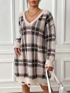 Women's V-neck oversized plaid knit sweater dress with distressed edges in autumn colors