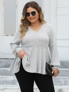 Women's V-neck grey peplum top with ribbed texture and long lantern sleeves in street style