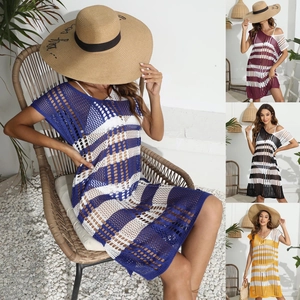 Detail showing colorful striped crochet knit texture on a hollow out beach cover-up dress