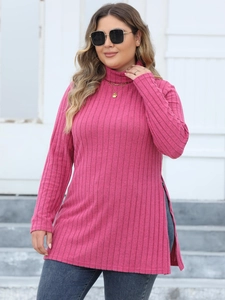Detail of high side slit on ribbed turtleneck knit top with vertical texture design
