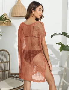 Detail of caramel crochet beach cover-up featuring knit texture and side slit design