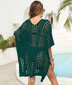 Detail view of the deep green crochet knit mesh fabric on this bohemian beach cover-up